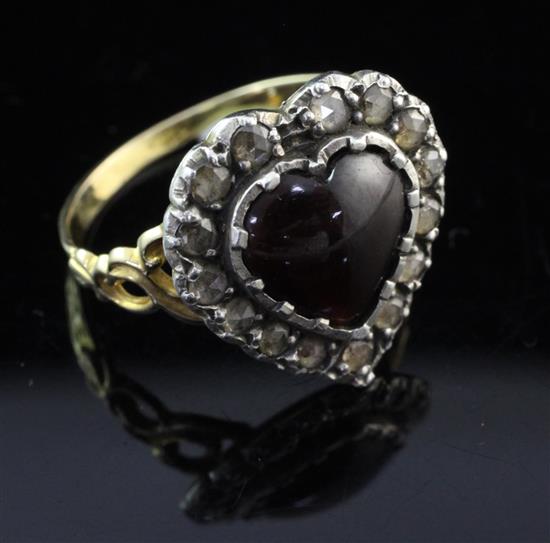 A 19th century style gold and silver, heart shaped garnet and rose cut diamond set ring, size M.